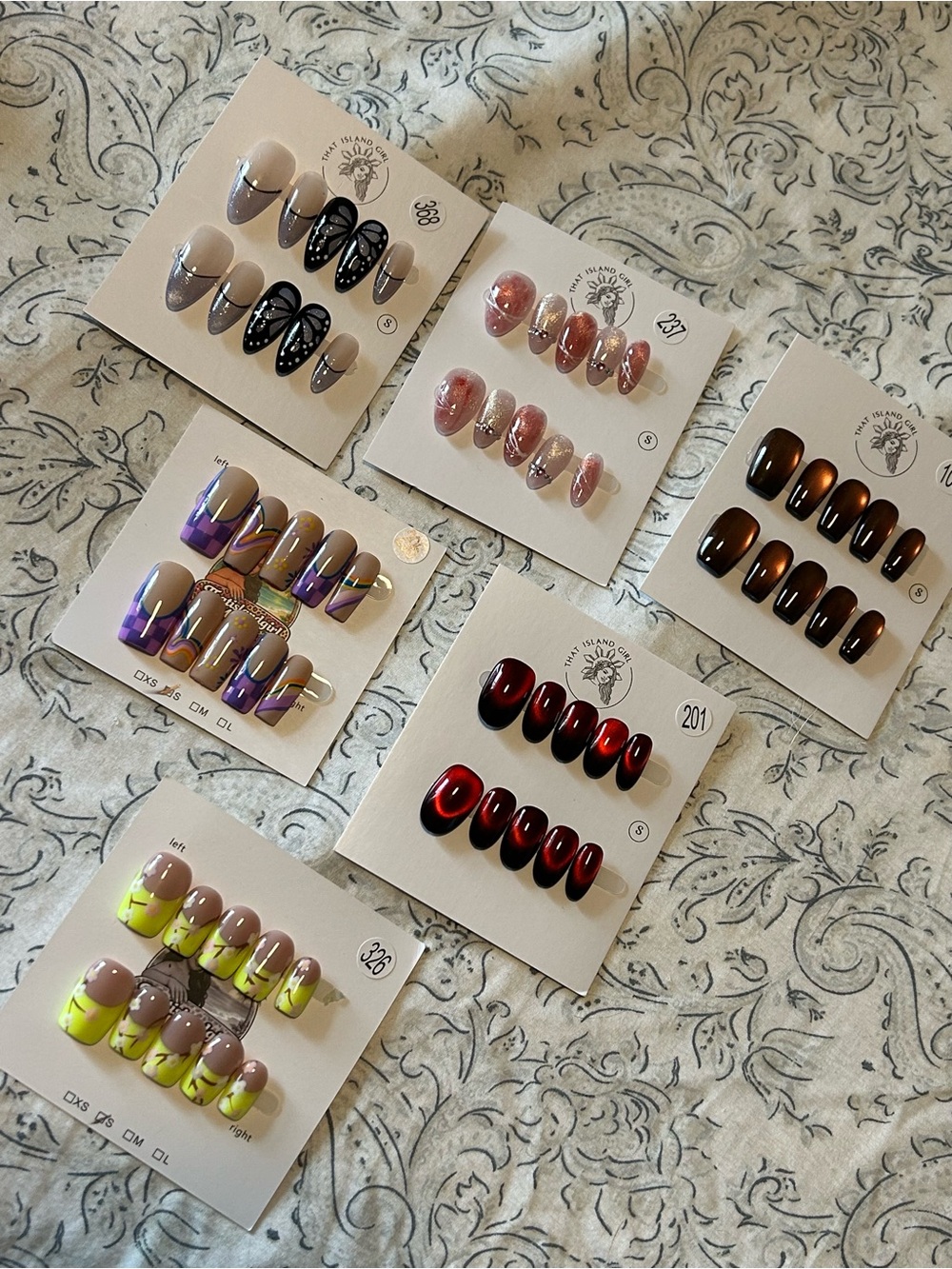 That Island Girl acrylic nails in various designs and colors- 6 sets